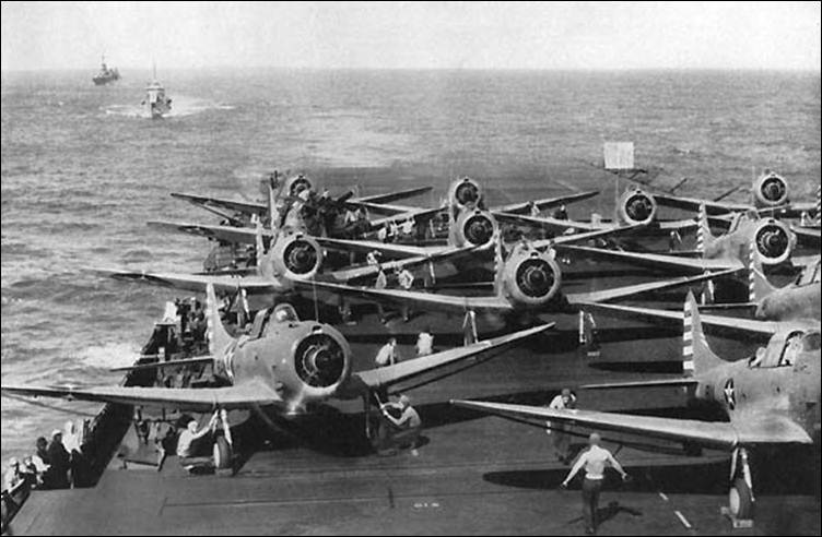 Description: Description: Bombing Six SBD-2s warm up on Enterprise's flight deck, preparing to strike Wake Island.